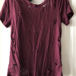 Brand new Purple Tee with cutouts and low back